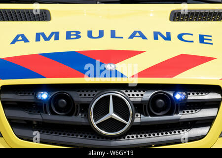 Dutch ambulance Mercedes-Benz Sprinter with active blue emergency lighting Stock Photo