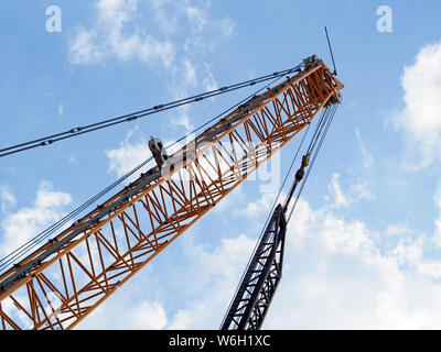 Liebherr LR 1250 250 ton Crawler Crane boom against blue sky with clouds. This crane being used in the New Corpus Christi Harbor Bridge project 2019. Stock Photo