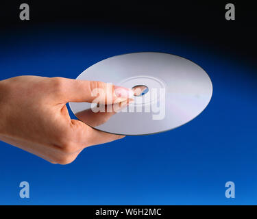 Woman holding a disk Stock Photo