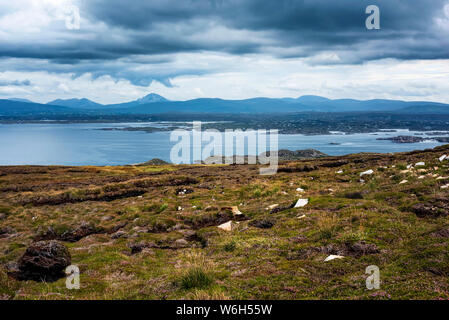 Distant mountain range viewed from the Atlantic coastline; Ireland Stock Photo