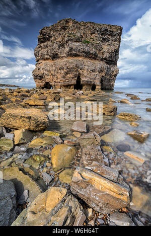 Marsden Rock, a 100 feet (30 metre) sea stack off the North East coast of England, situated at Marsden, South Shields Stock Photo