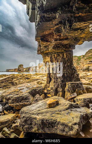 Inside Marsden Rock, a 100 feet (30 metre) sea stack off the North East coast of England, situated at Marsden, South Shields Stock Photo