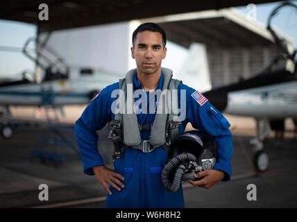 NASA astronaut candidate Raja Chari poses for a portrait wearing a blue flight suit on the flight line at the Johnson Space Center July 12, 2019 in Houston, Texas. Stock Photo