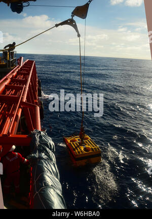 ROV crew team launching ROV to ocean for under water inspection Stock Photo