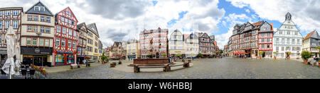 1 August 2019: Panorama of Market place (Marketplace, Marktplatz) with half-timbered colorful houses, town hall (Rathaus) in Butzbach, Hessen, Germany Stock Photo