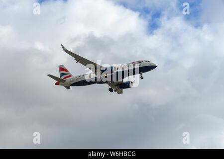 LONDON HEATHROW AIRPORT - MARCH 2019: Airbus A320 jet operated by British Airways coming in to land at London Heathrow Airport. Stock Photo