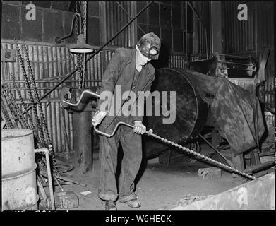 Harry Fain, coal loader assembles auger which he will use in drilling at the face. Inland Steel Company, Wheelwright #1 & 2 Mines, Wheelwright, Floyd County, Kentucky. Stock Photo