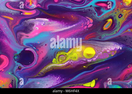 The vivid colors of this abstract painting convey a cosmic feel that is perfect for an interesting background. Stock Photo