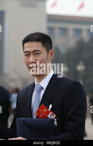 Retired Chinese table tennis player Wang Liqin arrives at the Great Hall of the People to attend the opening session for the First Session of the 13th Stock Photo