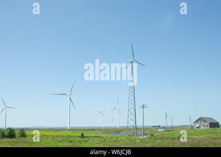 Amherst, Nova Scotia- July 28, 2019: View of turbines on Tantramar Marsh with windmills passing from the highway Stock Photo