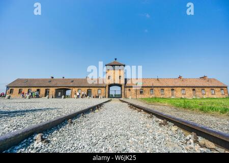 Railway leading to main entrance of Auschwitz Birkenau concentration camp, museum nowadays, Poland Stock Photo