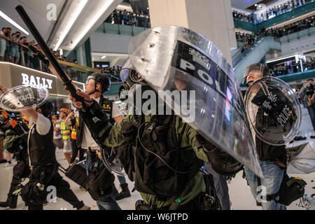 Police clash with protesters during anti-extradition bill demonstrations in Sha Tin, Hong Kong on the 14th of July 2019. Pro-democracy protesters continue with demonstrations as they call for the complete withdrawal of a controversial extradition bill and the resignation of Hong Kong Chief Executive Carrie Lam. Stock Photo