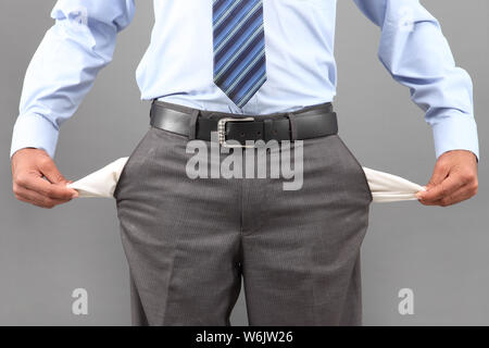 Mid section view of a businessman showing his empty pockets Stock Photo