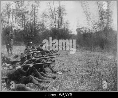 Pasig. Oregon Volunteer Infantry on firing line, March 14, 1899., 03/14/1899; General notes:  Use War and Conflict Number 311 when ordering a reproduction or requesting information about this image. Stock Photo