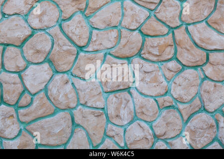 Seamless masonry wall with irregular shaped stones Stock Photo