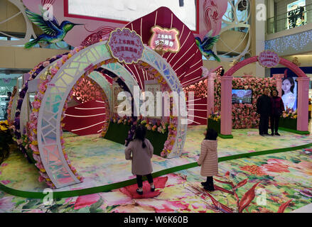 Children enjoy the hand-crafted pop-up 3D paper artworks created by Polish artist and illustrator Bozena Rydlewska on display during the 'New Bot-any' Stock Photo