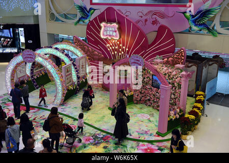 Customers take photos of the hand-crafted pop-up 3D paper artworks created by Polish artist and illustrator Bozena Rydlewska on display during the 'Ne Stock Photo