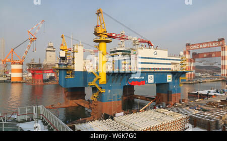 The semi-submersible accommodation vessel (SSAV), OOS Tiradentes, berths at the quay of a port before leaving for Brazil in Yantai city, east China's Stock Photo