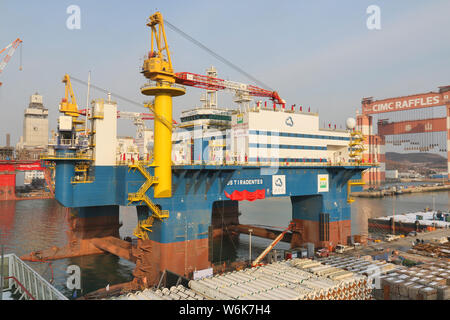 The semi-submersible accommodation vessel (SSAV), OOS Tiradentes, berths at the quay of a port before leaving for Brazil in Yantai city, east China's Stock Photo