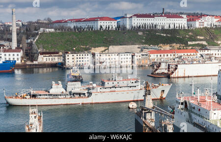 Russian Navy supply warship goes at Yuzhnaya Bay, one of the harbour bays in Sevastopol, Crimea Stock Photo