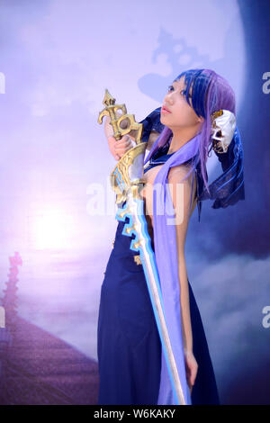 A Chinese coser dressed in cosplay costume poses during an animation ...