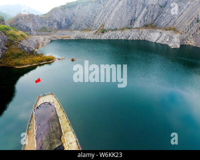 View of a heart-shape pond which was once a stone quarry, abandoned three years ago, at Shapingba District in Chongqing, China, 8 January 2018.   Bene Stock Photo