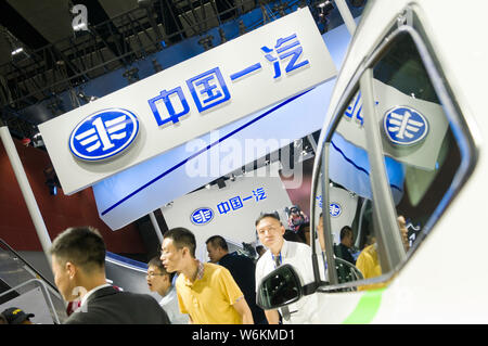 --FILE--People visit the stand of FAW during the 15th China (Guangzhou) International Automobile Exhibition, also known as Auto Guangzhou 2017, in Gua Stock Photo