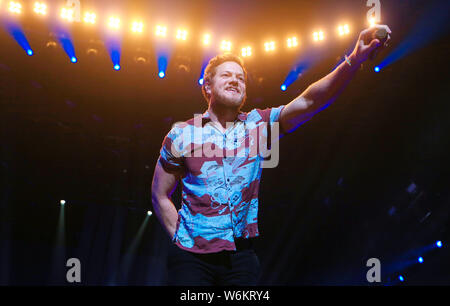 American singer-songwriter Daniel Coulter Reynolds (Dan Reynolds), the lead vocalist of American rock band Imagine Dragons, performs during the band's Stock Photo