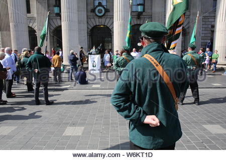 A military parade has taken place in Dublin to commemorate the 1916 Rising. Activists in military style uniform marched through Dublin followed by a s Stock Photo