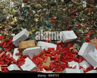 2,333 cartons of counterfeit Zhonghua brand cigarettes are being destroyed in an incinerator during a winter operation in Zhenjiang city, east China's Stock Photo