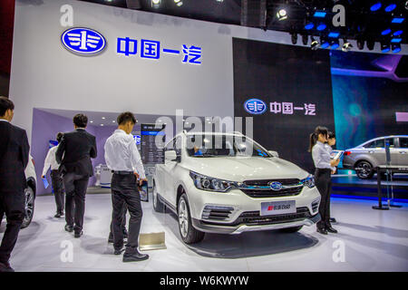 --FILE--People visit the stand of FAW during the 15th China (Guangzhou) International Automobile Exhibition, also known as Auto Guangzhou 2017, in Gua Stock Photo