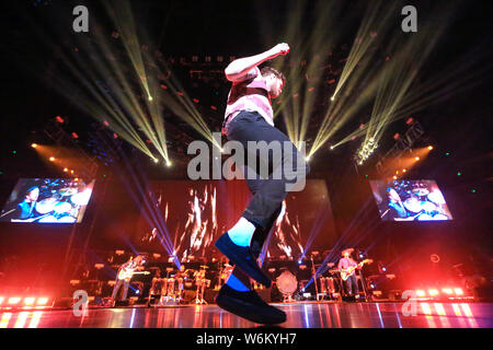 American singer-songwriter Daniel Coulter Reynolds (Dan Reynolds), the lead vocalist of American rock band Imagine Dragons, performs during the band's Stock Photo