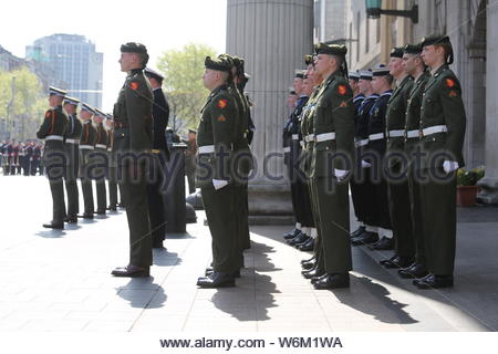 A military parade has taken place in Dublin to commemorate the 1916 Rising. President Michael D Higgins lead a wreath in front of the GPO the building Stock Photo