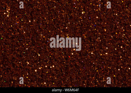 Saturated brown, dark orange colour background with glitter. High resolution photo. Stock Photo