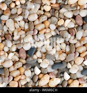 Quartz stones in red, orange, gray and white colors. Seamless square texture. Stock Photo