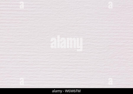 Clean light pink lined paper texture on macro. High resolution photo. Stock Photo