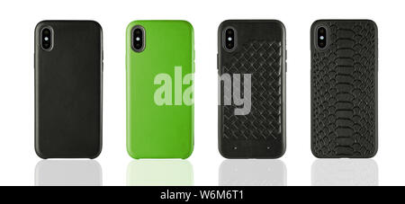Four Black and Green phone leather cases on white isolated background, classic design accessories. Stock Photo