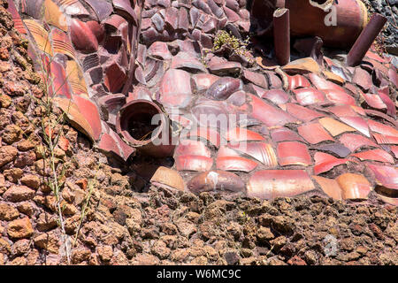 abstract background with differents stones and a pipe Stock Photo