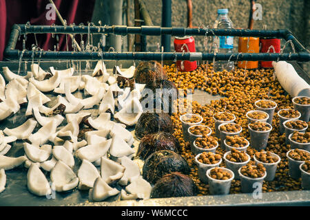 close up of fruit in food stall with coconuts and chufas outdoors Stock Photo