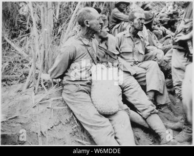 The March of Death. Along the March [on which] these prisoners were photographed, they have their hands tied behind their backs. The March of Death was about May 1942, from Bataan to Cabanatuan, the prison camp.; General notes:  Use War and Conflict Number 1144 when ordering a reproduction or requesting information about this image. Stock Photo