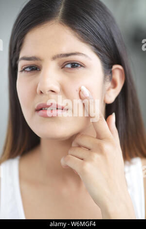 Woman with pimple on face Stock Photo - Alamy