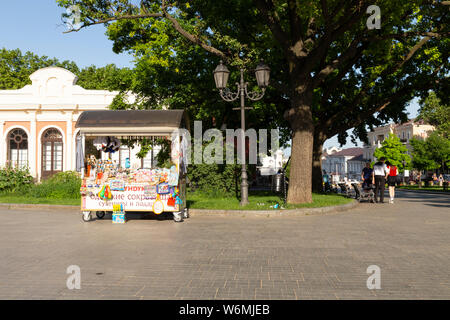 Ukraine, Odessa, opera park, 12th of June 2019. Front view of a small market stand with roof selling souvenirs to visitors in the park of the opera. Stock Photo