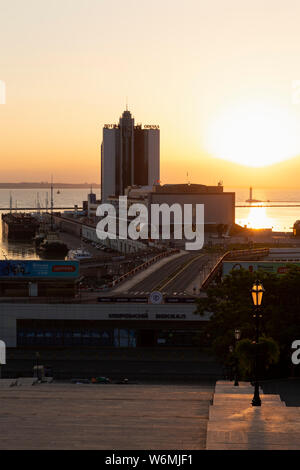 Ukraine, Odessa, Primorsky Boulevard, 13th of June 2019. View down the Potemkin Stairs on the seaport and the Hotel Odessa at dawn. Stock Photo