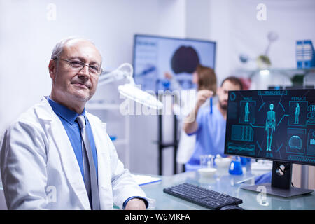 Portrait of senior scientist man looking at the camera in a science laboratory. Research engineer. Stock Photo