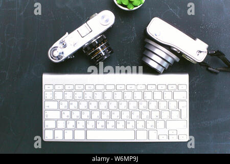 open daily, a computer and a smartphone on the desktop in the o Stock Photo