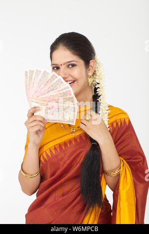 South Indian woman showing banknotes Stock Photo