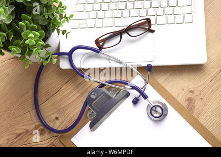 Stethoscope on laptop keyboard. Concept 3D image. Stock Photo