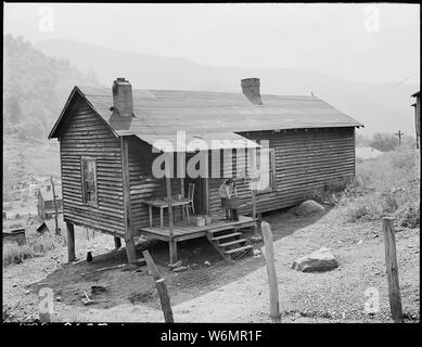 Typical house and back porch scene. This is home of Rufus Sergent, miner, son of Blaine Sergent. P V & K Coal Company, Clover Gap Mine, Lejunior, Harlan County, Kentucky. Stock Photo