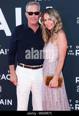 Hollywood, United States. 01st Aug, 2019. HOLLYWOOD, LOS ANGELES, CALIFORNIA, USA - AUGUST 01: Actor Kevin Costner and wife Christine Baumgartner arrive at the Los Angeles Premiere Of 20th Century Fox's 'The Art Of Racing In The Rain' held at the El Capitan Theatre on August 1, 2019 in Hollywood, Los Angeles, California, United States. (Photo by Xavier Collin/Image Press Agency) Credit: Image Press Agency/Alamy Live News Stock Photo