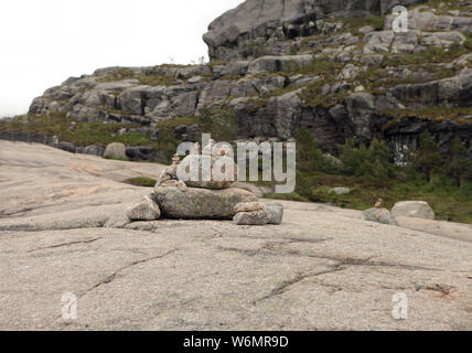 Granite rocks and mountains on the Road to the Cliff Preikestolen in fjord Lysefjord - Norway - nature and travel background. Vacation concept. Stock Photo